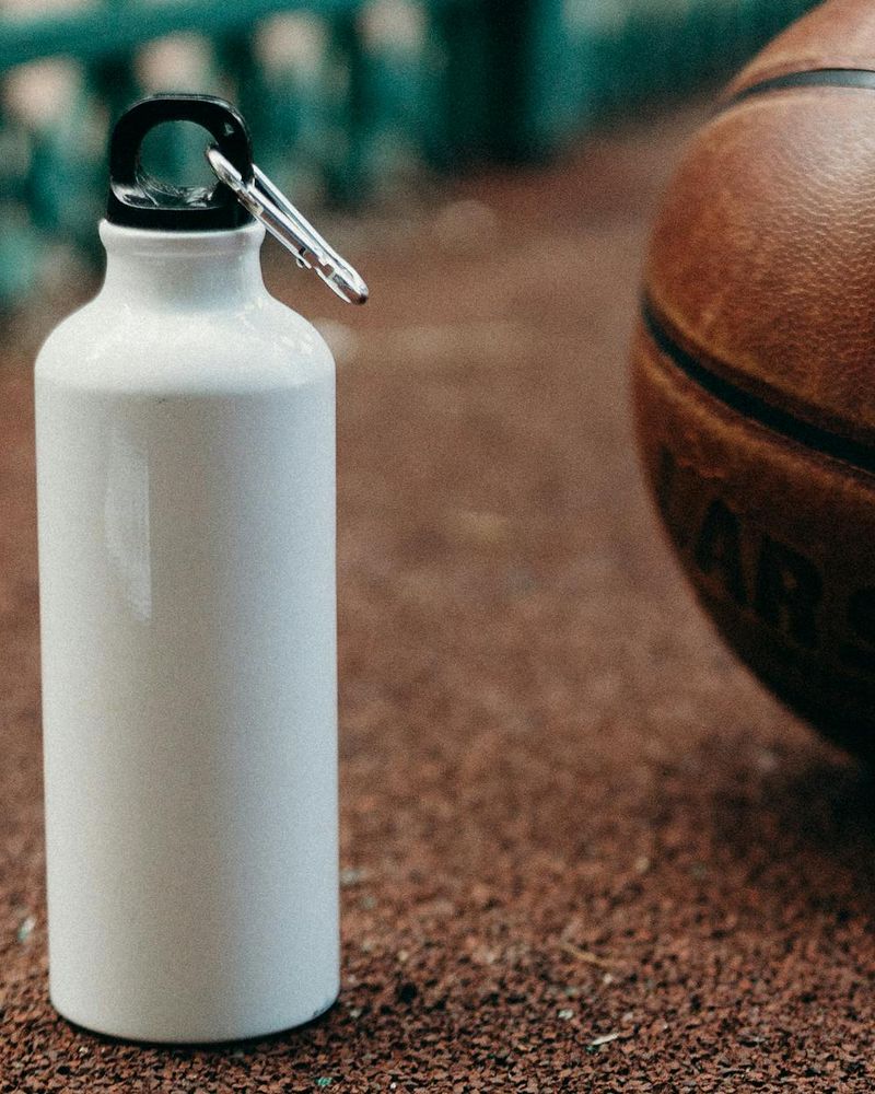 Close up of sports equipment and water bottle in a modern studio