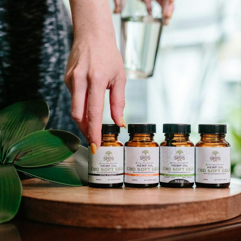 Person hands reaching for a bottle of water in gym
